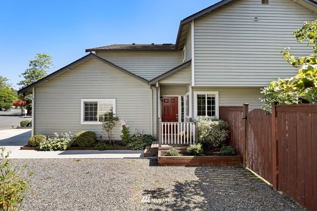 2102 186th Place Southeast Bothell, WA 98012 - Photo 3 of 31 a front view of a house with garden