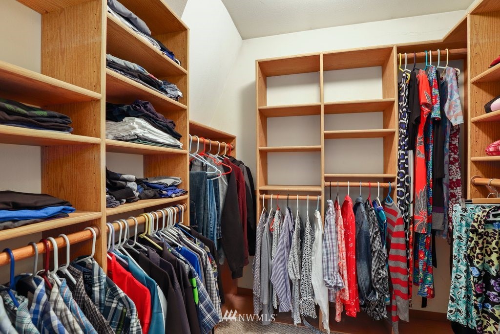 2102 186th Place Southeast Bothell, WA 98012 - Photo 21 of 31 a view of walk in closet with clothes and shoes