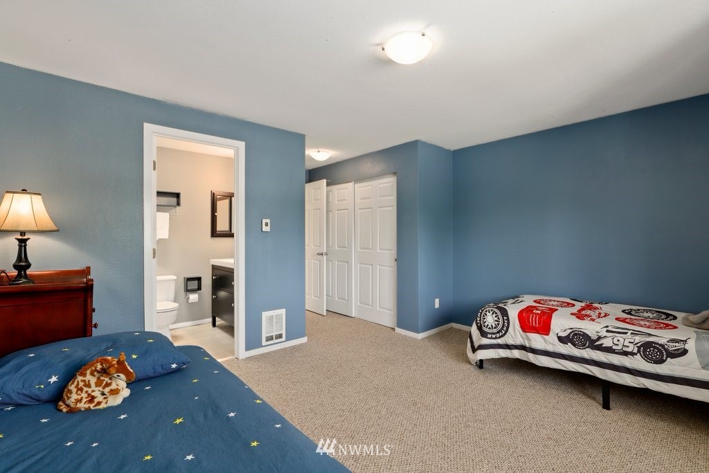 2102 186th Place Southeast Bothell, WA 98012 - Photo 22 of 31 a bedroom with a bed and a dresser