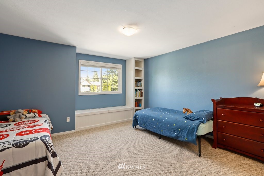 2102 186th Place Southeast Bothell, WA 98012 - Photo 23 of 31 a bedroom with a bed and a window