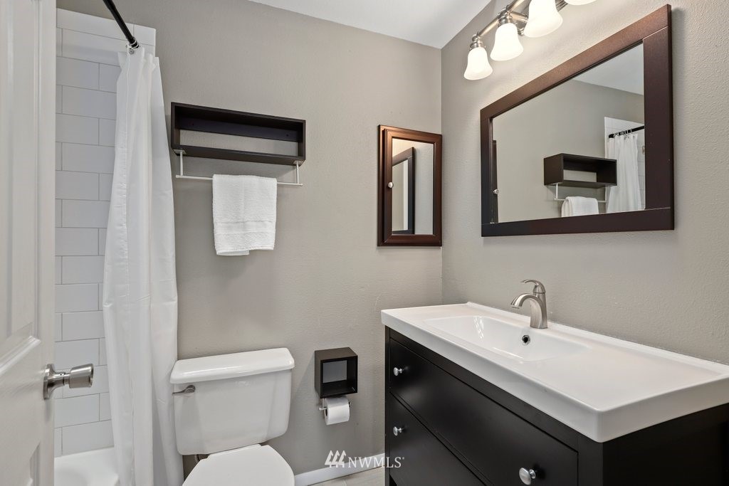 2102 186th Place Southeast Bothell, WA 98012 - Photo 24 of 31 a bathroom with a toilet sink and mirror