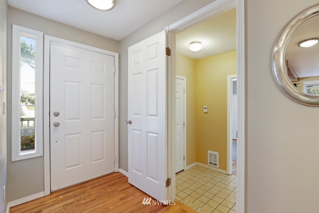 2102 186th Place Southeast Bothell, WA 98012 - Photo 4 of 31 wooden floor in a house and a mirror