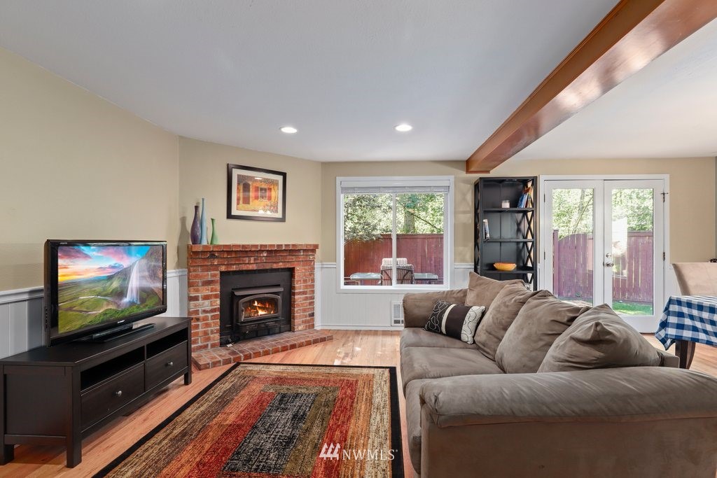 2102 186th Place Southeast Bothell, WA 98012 - Photo 6 of 31 a living room with furniture and a flat screen tv