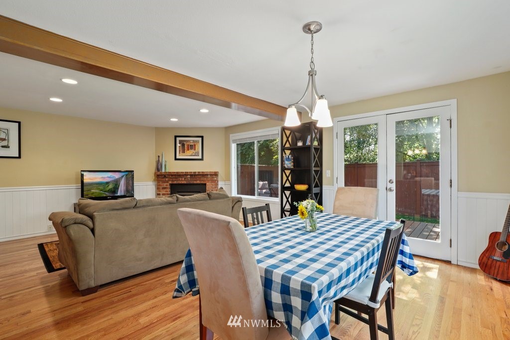 2102 186th Place Southeast Bothell, WA 98012 - Photo 9 of 31 a view of a dining room with furniture window and wooden floor