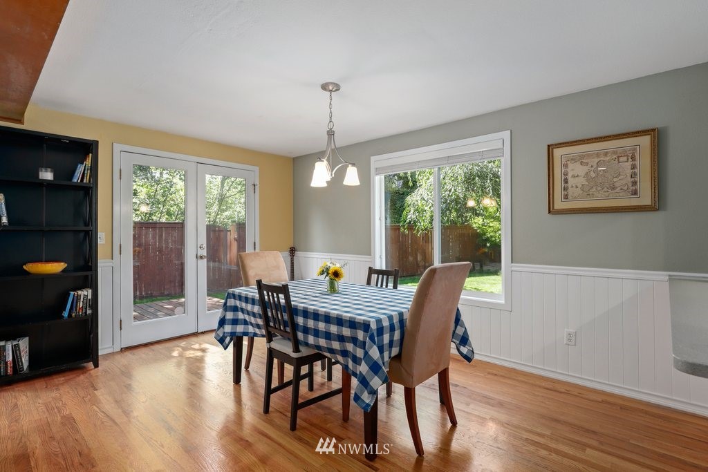 2102 186th Place Southeast Bothell, WA 98012 - Photo 10 of 31 a view of a dining room with furniture window and wooden floor