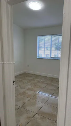 a bathroom with white walls