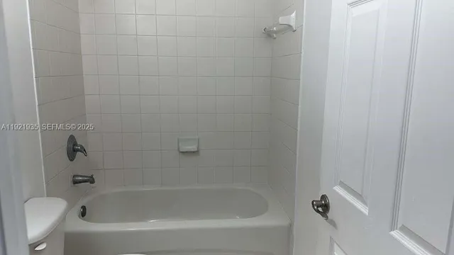 an empty room with closet area