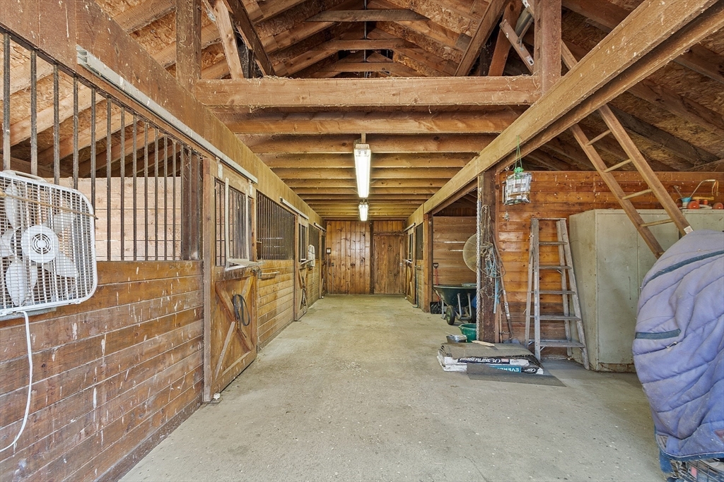 819 West Street Lunenburg, MA 01462 - Photo 11 of 42 a view of an empty room with stairs
