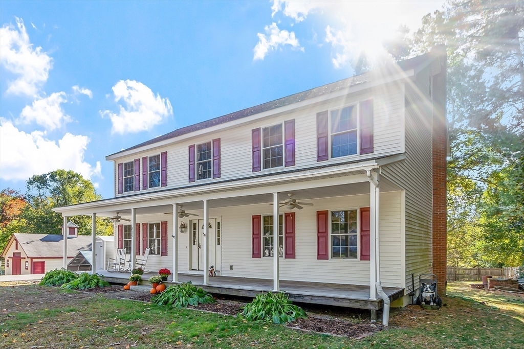 819 West Street Lunenburg, MA 01462 - Photo 2 of 42 a front view of a house with a yard