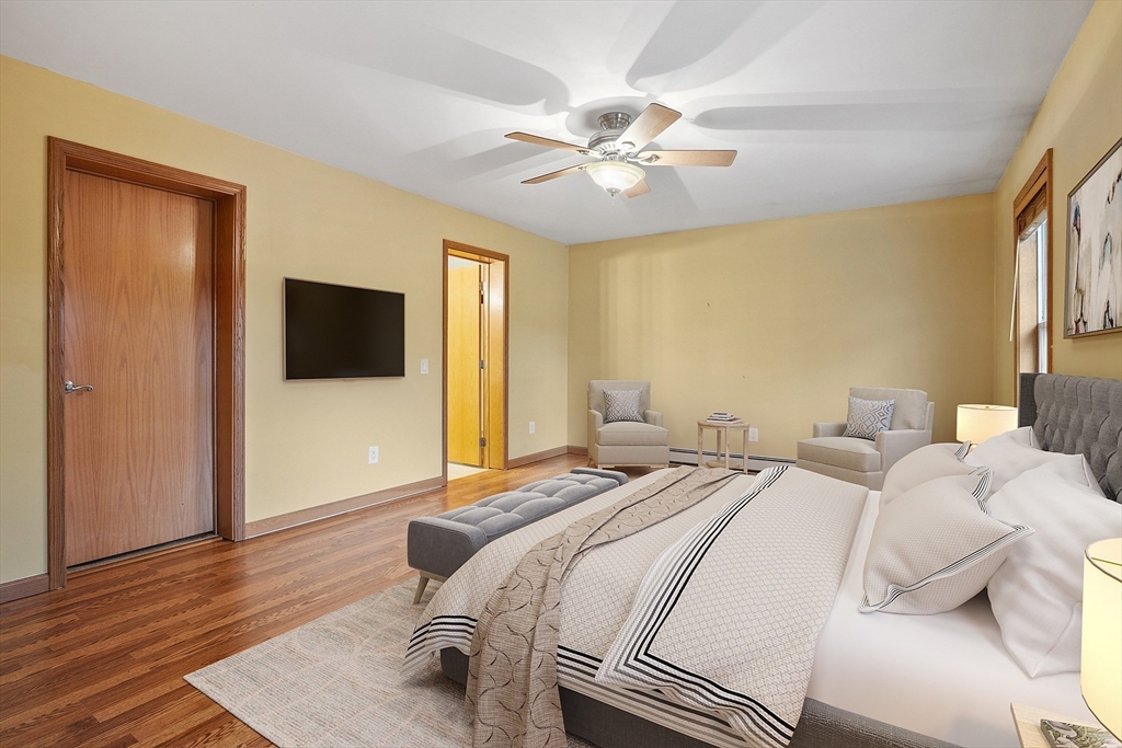 819 West Street Lunenburg, MA 01462 - Photo 35 of 42 a bedroom with a bed and a flat screen tv