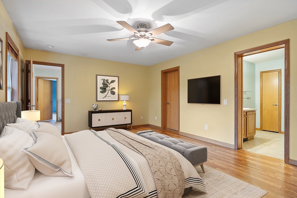 819 West Street Lunenburg, MA 01462 - Photo 36 of 42 a bedroom with a bed and a tv