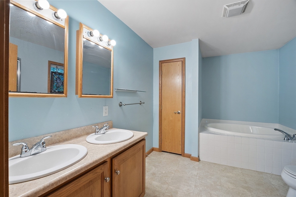 819 West Street Lunenburg, MA 01462 - Photo 37 of 42 a bathroom with a sink and a mirror