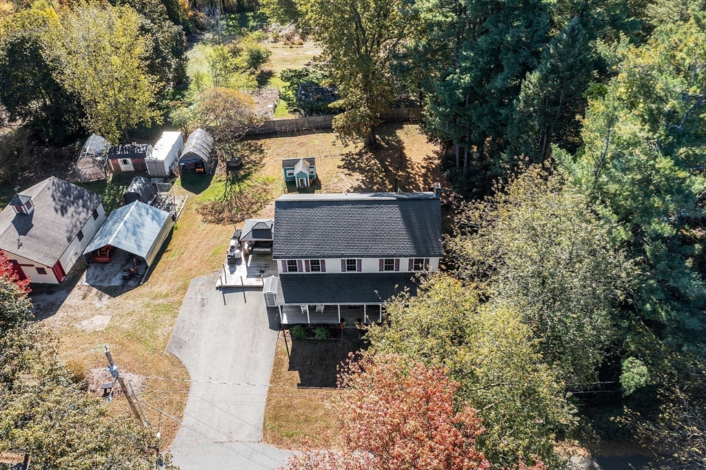819 West Street Lunenburg, MA 01462 - Photo 4 of 42 a aerial view of a house with swimming pool and large trees