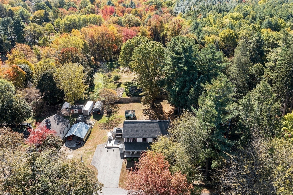 819 West Street Lunenburg, MA 01462 - Photo 5 of 42 an aerial view of a house with a yard and garden
