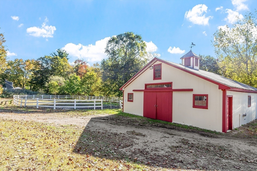 819 West Street Lunenburg, MA 01462 - Photo 8 of 42 a view of a house with backyard and trees