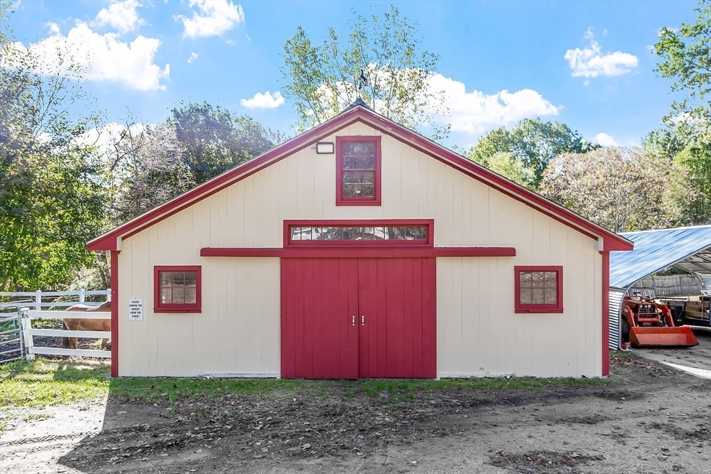 819 West Street Lunenburg, MA 01462 - Photo 9 of 42 a view of a house with a yard