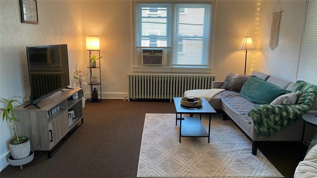 451-453 Philadelphia Street Indiana, PA 15701 - Photo 14 of 23 a living room with furniture and a flat screen tv