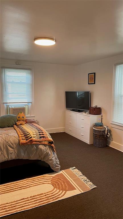 451-453 Philadelphia Street Indiana, PA 15701 - Photo 17 of 23 a bedroom with a bed and wooden floor