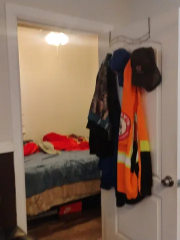 a room with a flat screen tv and a couch