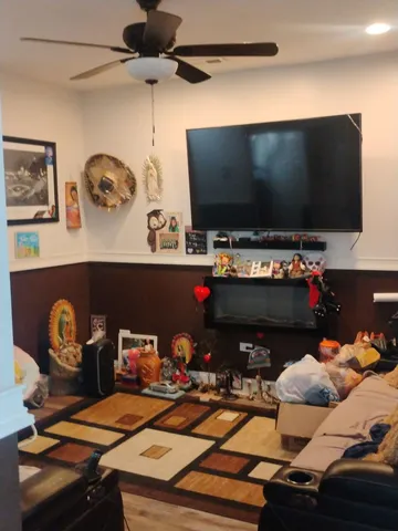 a kitchen with a refrigerator and a stove