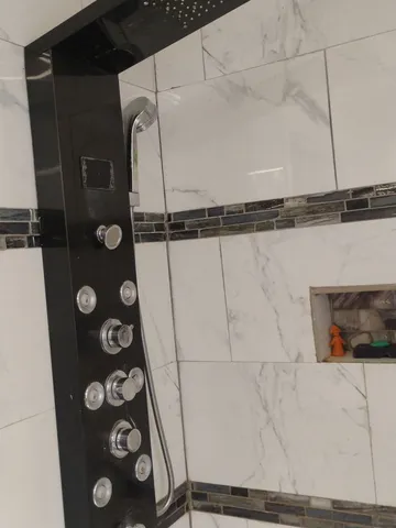 a bathroom with a sink a toilet and a window