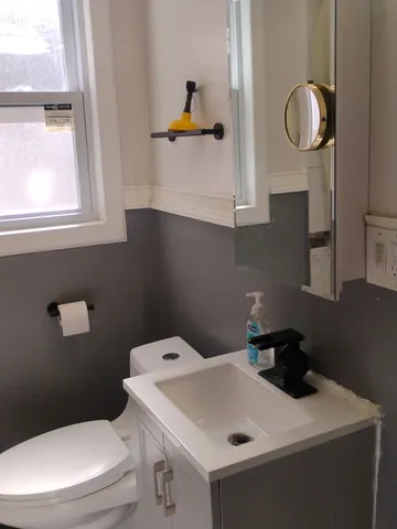 a view of a brick house with wooden wall