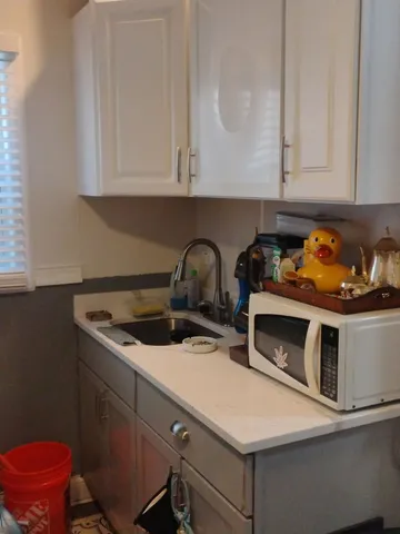 a kitchen with stainless steel appliances kitchen island granite countertop a refrigerator and a stove