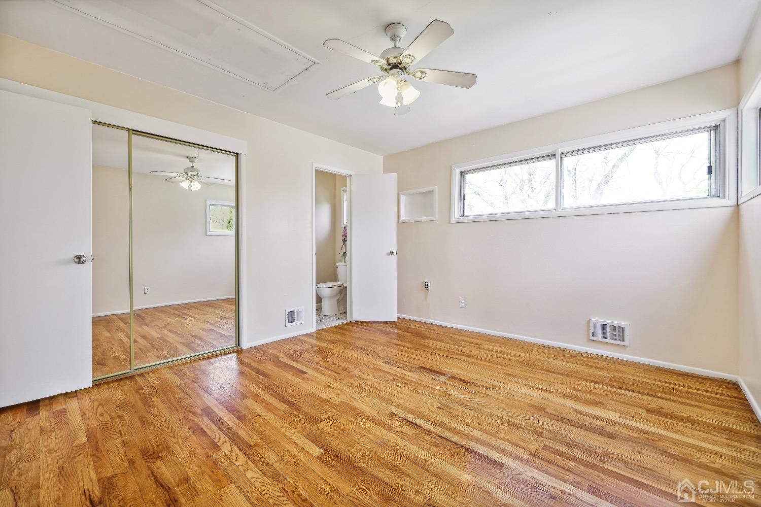 21 Rutgers Road Old Bridge, NJ 08859 - Photo 13 of 27 a bedroom with a bed and a chandelier fan