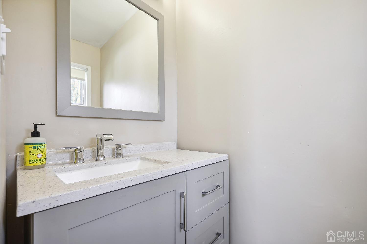 21 Rutgers Road Old Bridge, NJ 08859 - Photo 14 of 27 a bathroom with a sink and a mirror