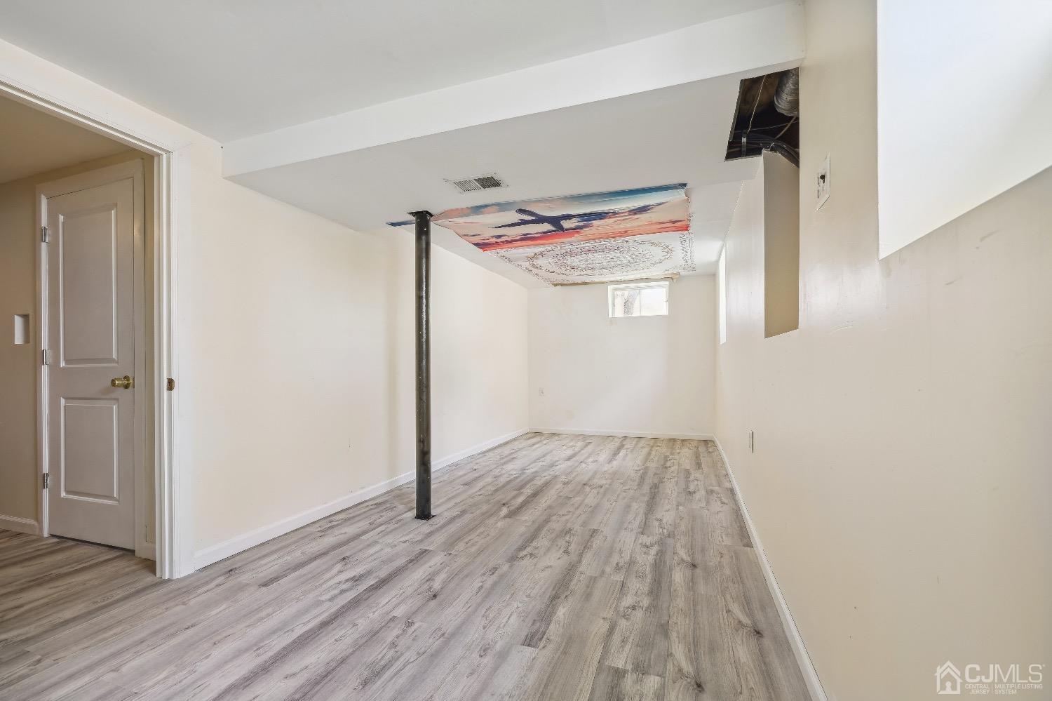 21 Rutgers Road Old Bridge, NJ 08859 - Photo 22 of 27 wooden floor in an empty room