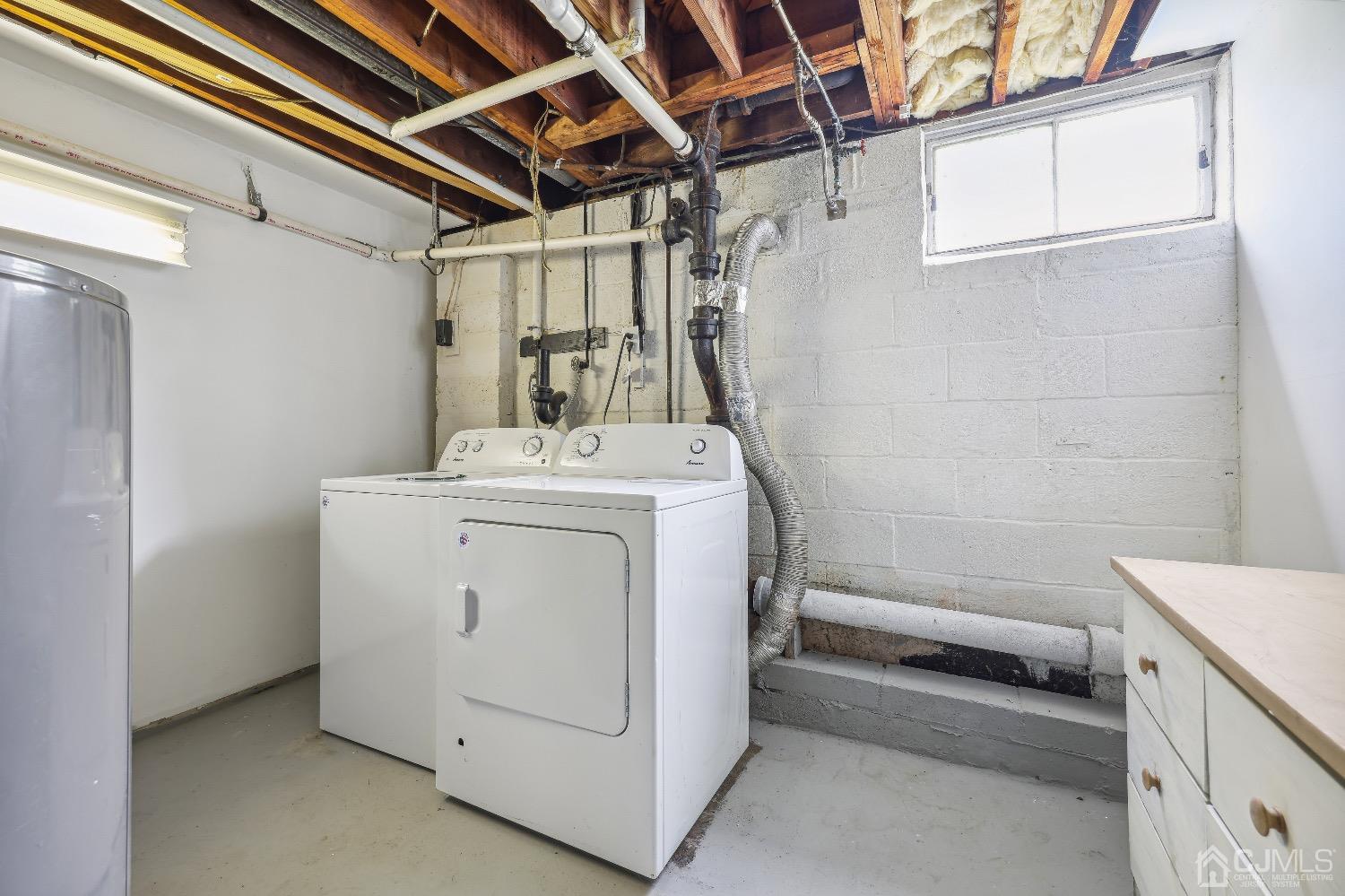 21 Rutgers Road Old Bridge, NJ 08859 - Photo 23 of 27 a utility room with dryer and washer