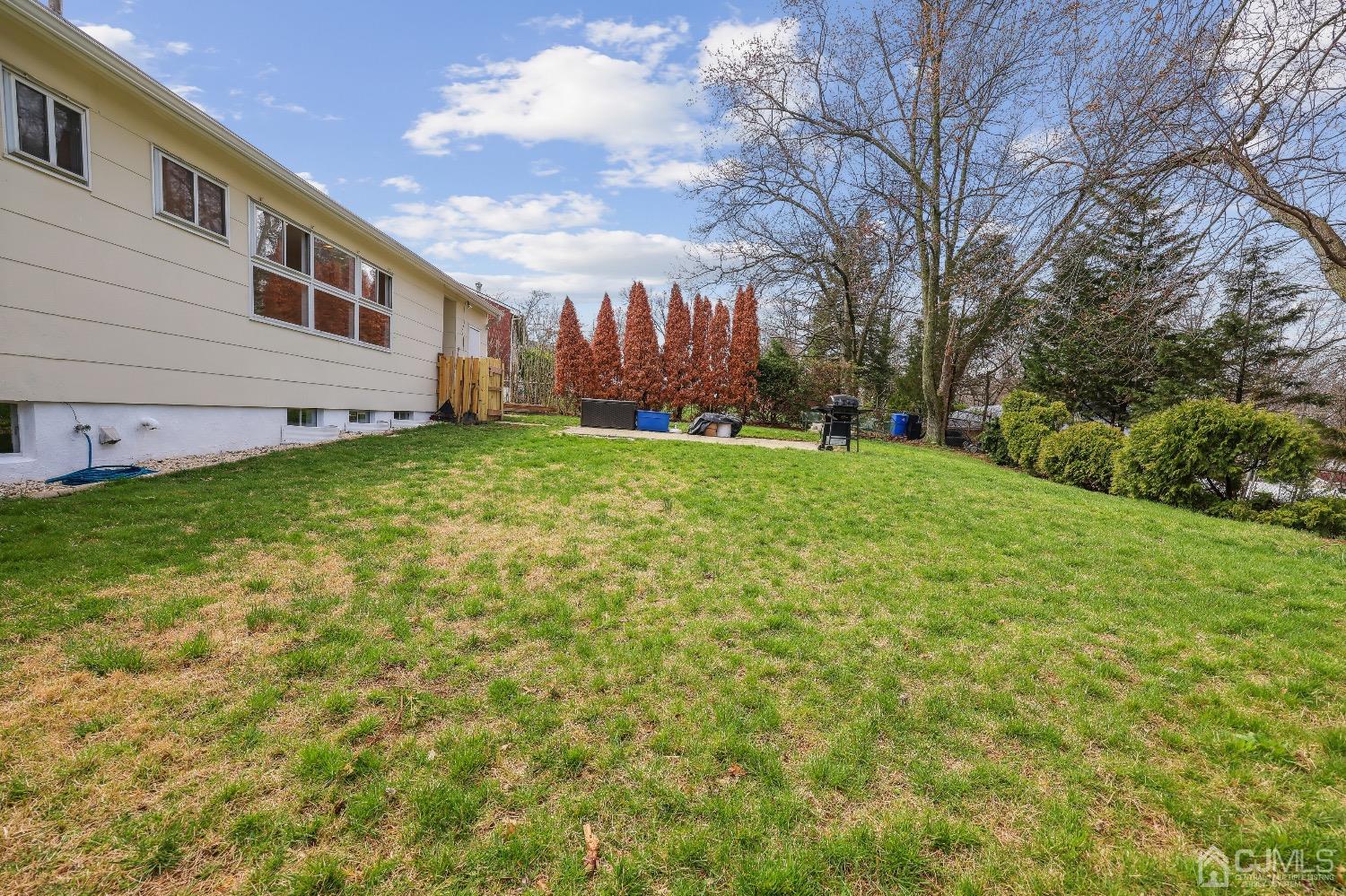 21 Rutgers Road Old Bridge, NJ 08859 - Photo 25 of 27 a view of a backyard with large trees