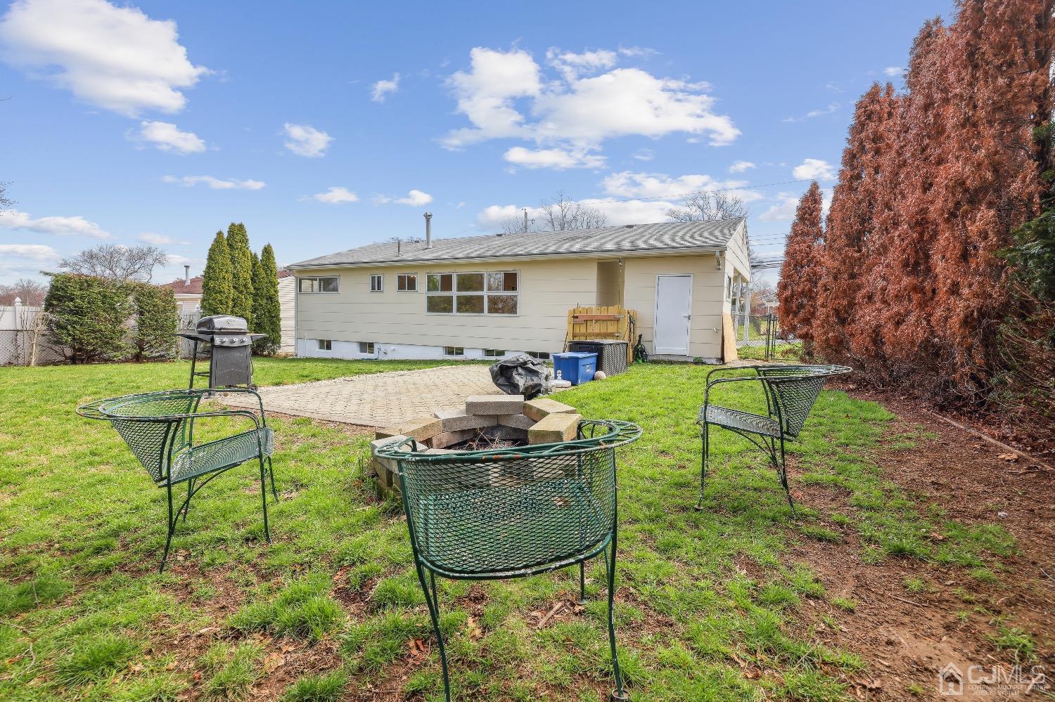 21 Rutgers Road Old Bridge, NJ 08859 - Photo 26 of 27 a backyard of a house with table and chairs