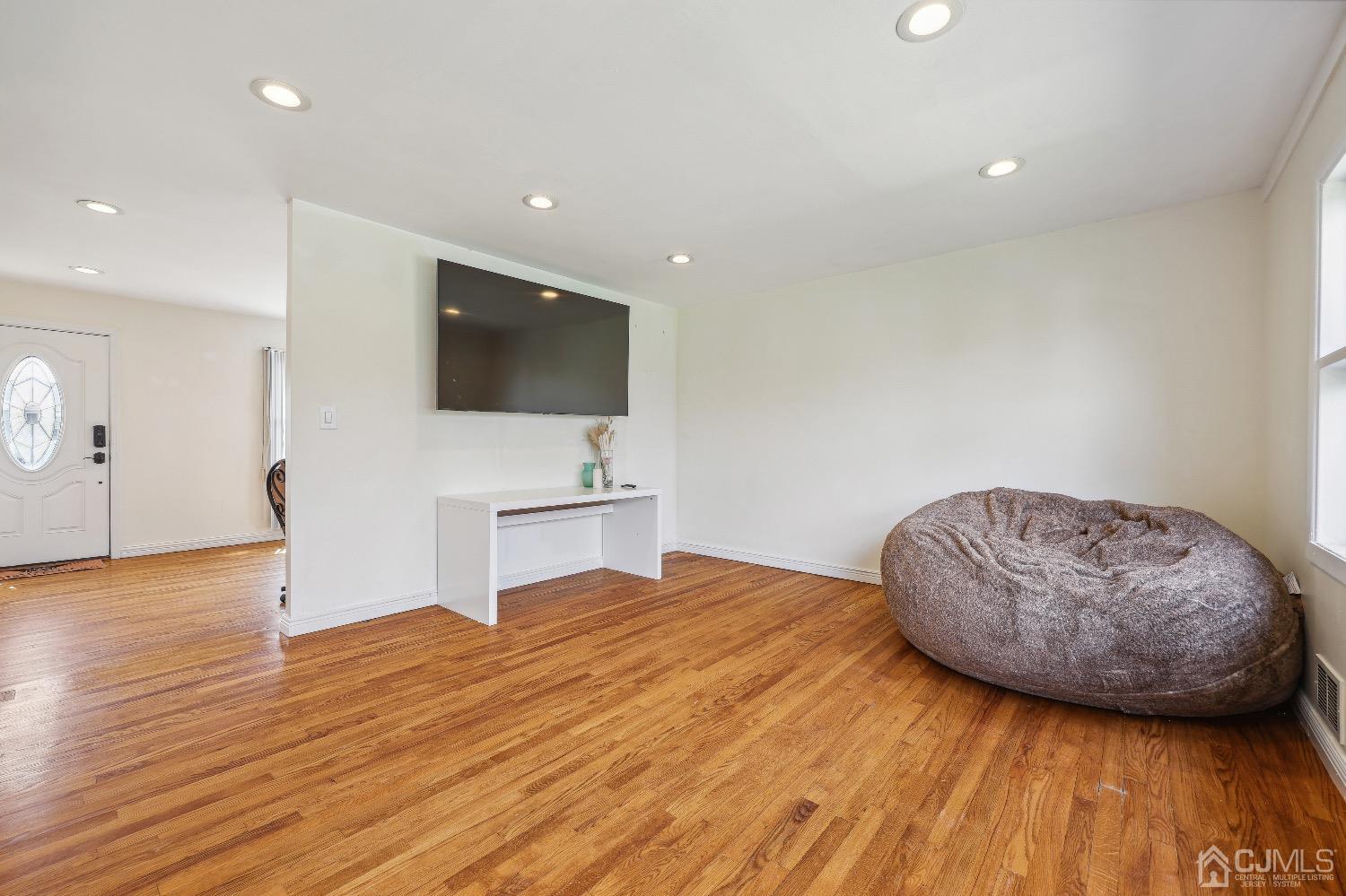 21 Rutgers Road Old Bridge, NJ 08859 - Photo 8 of 27 a bedroom with a bed and a flat screen tv