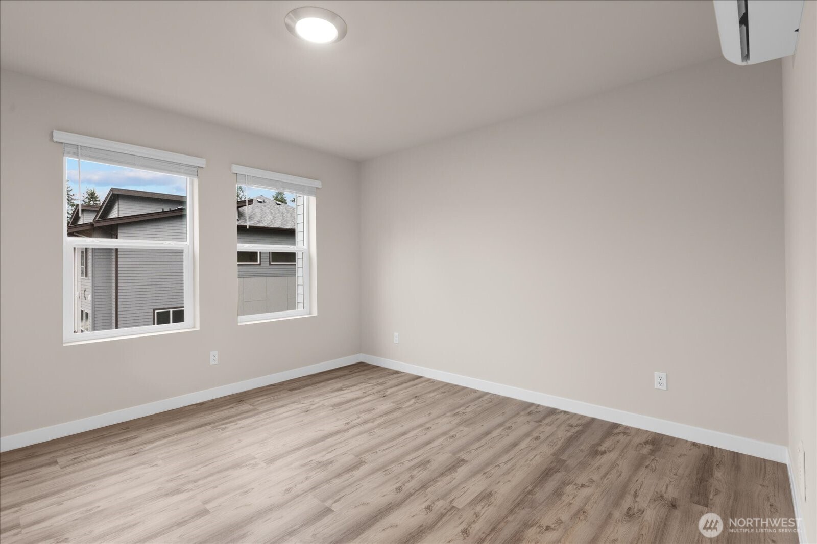 23413 Edmonds Way, Unit A2 Edmonds, WA 98026 - Photo 26 of 40 a view of empty room with wooden floor and fan