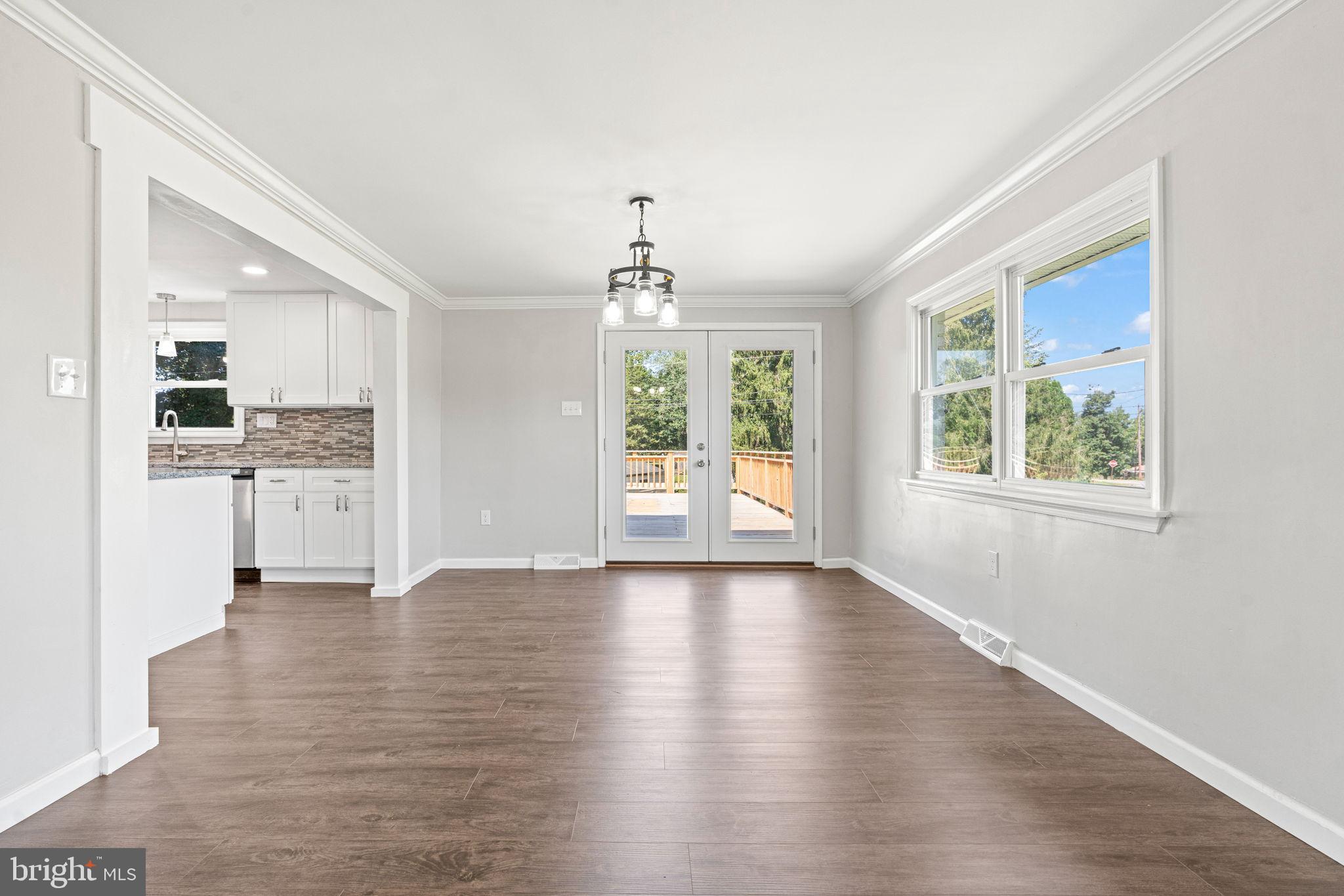 1005 2nd Avenue Manchester, PA 17345 - Photo 12 of 54 an empty room with wooden floor and windows
