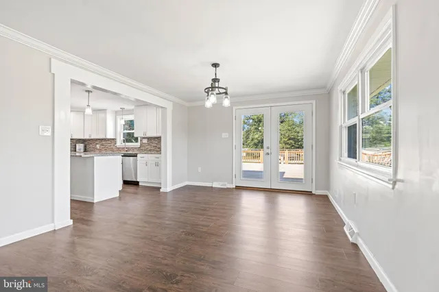 a view of a kitchen with a stove cabinets and wooden floor