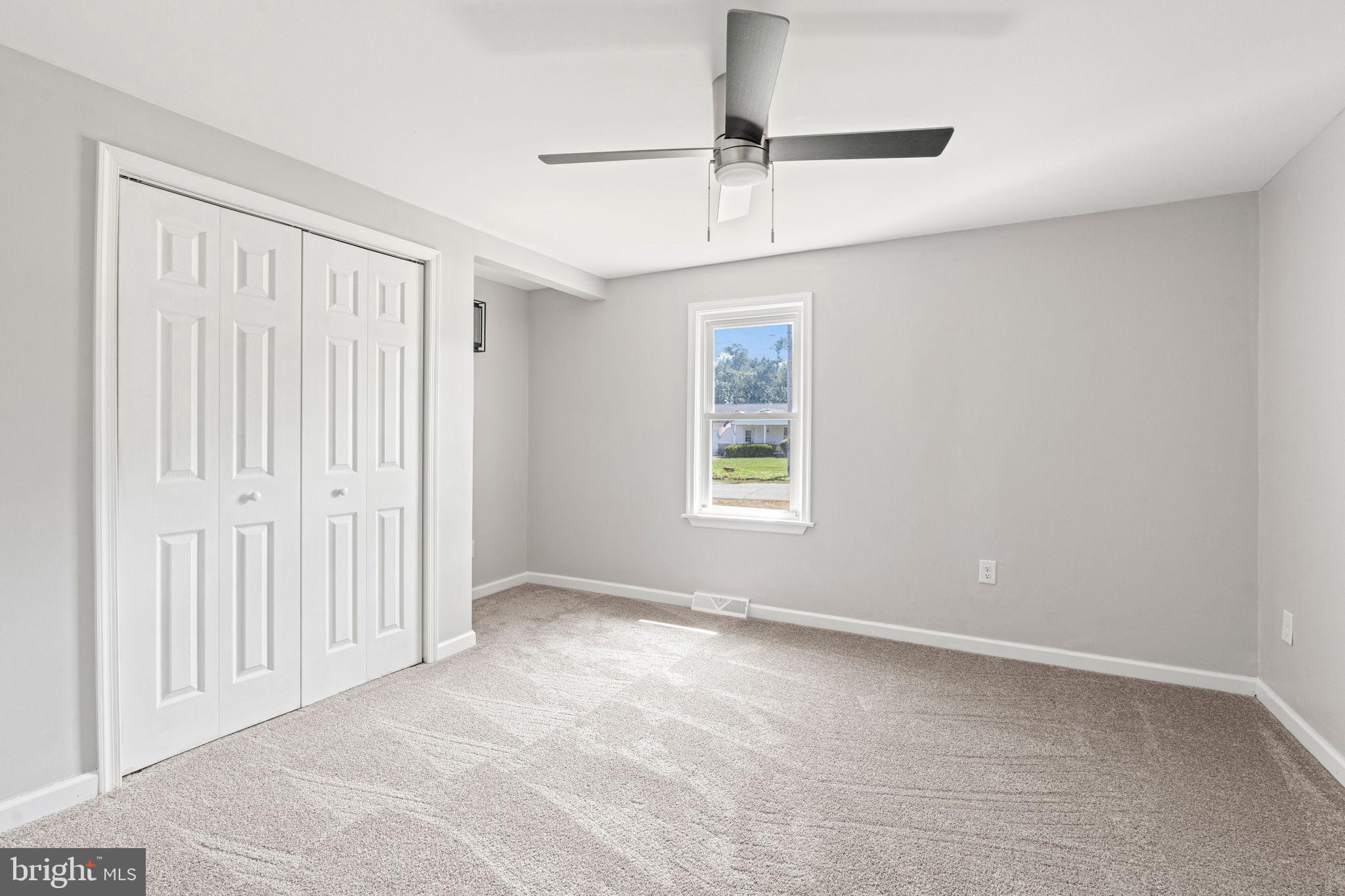 1005 2nd Avenue Manchester, PA 17345 - Photo 19 of 54 an empty room with windows and fan