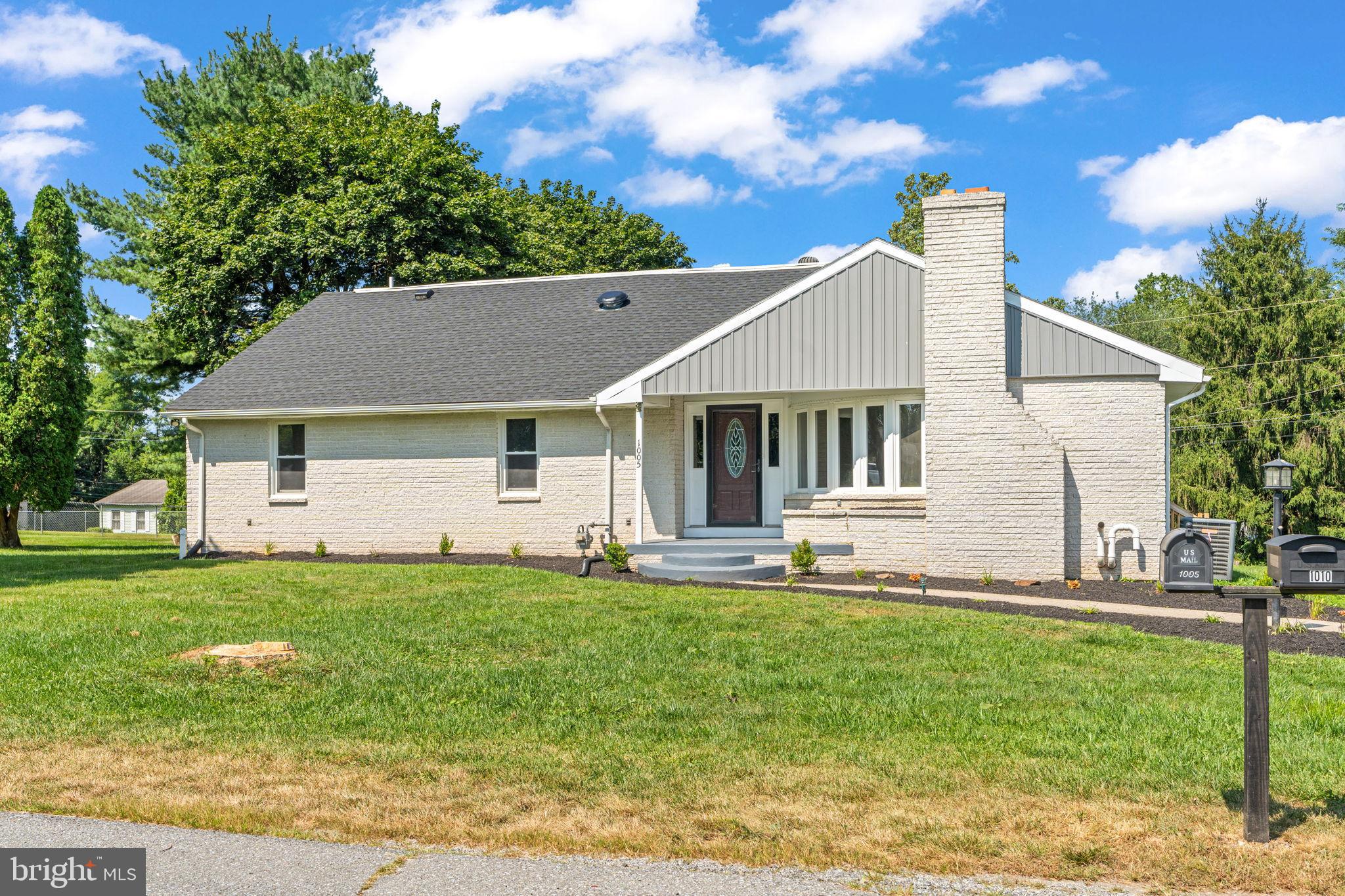 1005 2nd Avenue Manchester, PA 17345 - Photo 2 of 54 a front view of a house with a yard and trees