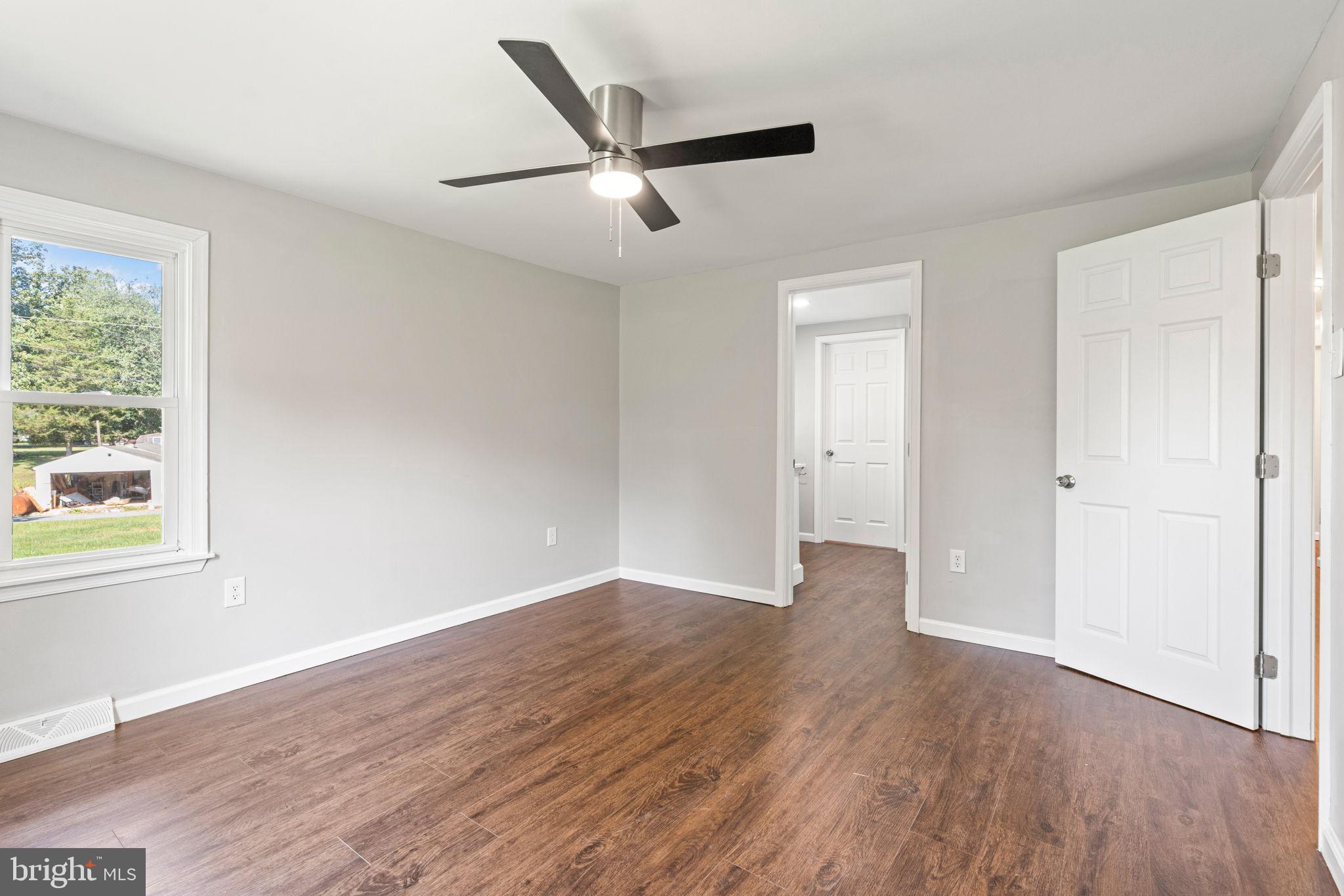1005 2nd Avenue Manchester, PA 17345 - Photo 26 of 54 a view of an empty room with wooden floor and a window