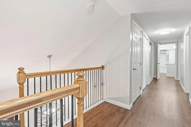 a bathroom with a toilet sink and a mirror