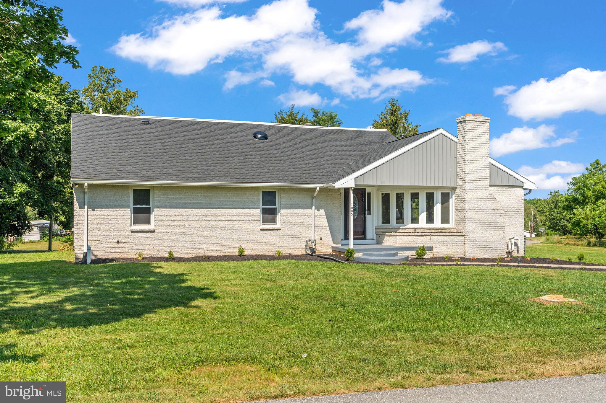 1005 2nd Avenue Manchester, PA 17345 - Photo 4 of 54 a front view of a house with a garden and yard