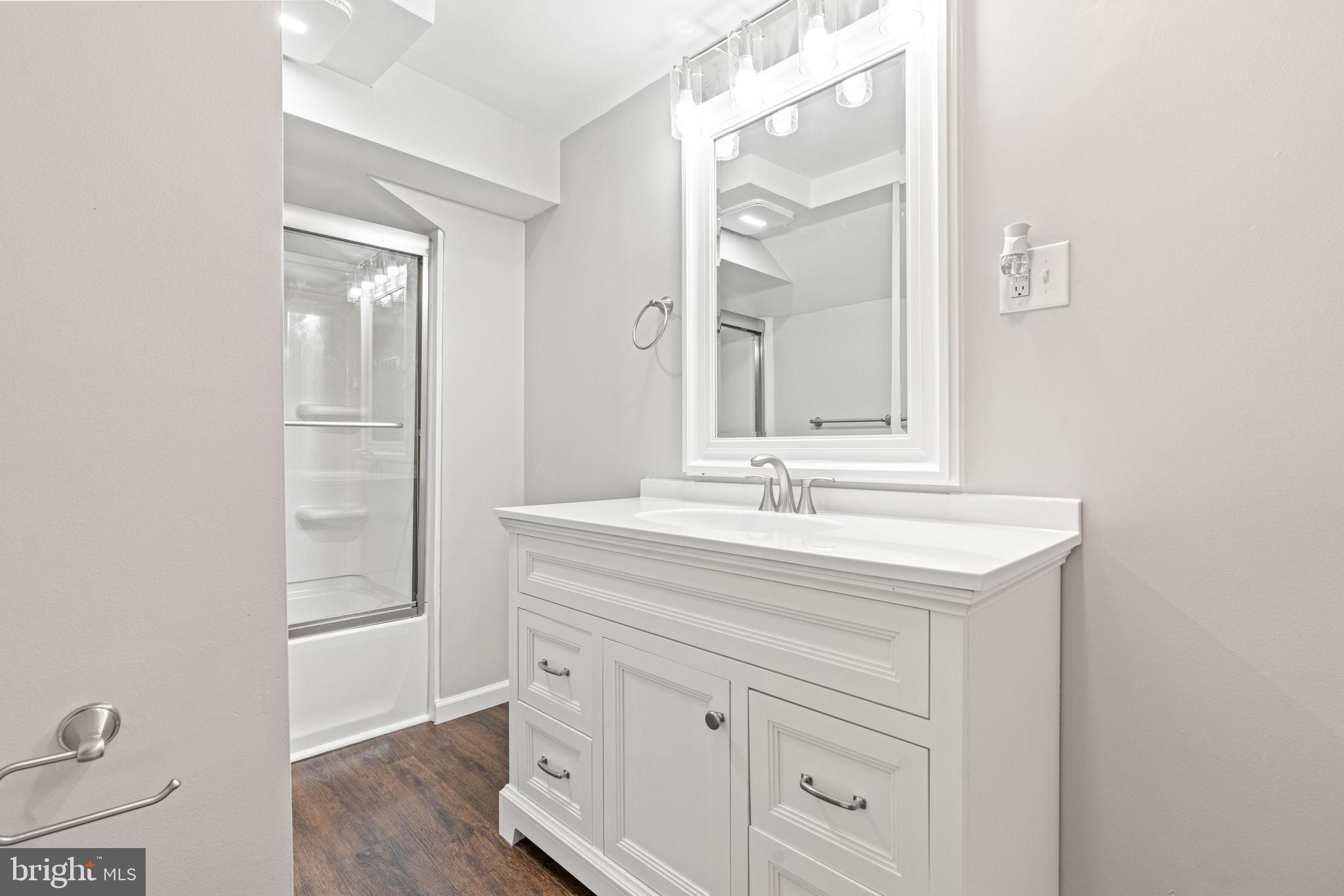1005 2nd Avenue Manchester, PA 17345 - Photo 43 of 54 a bathroom with a sink a vanity and a mirror