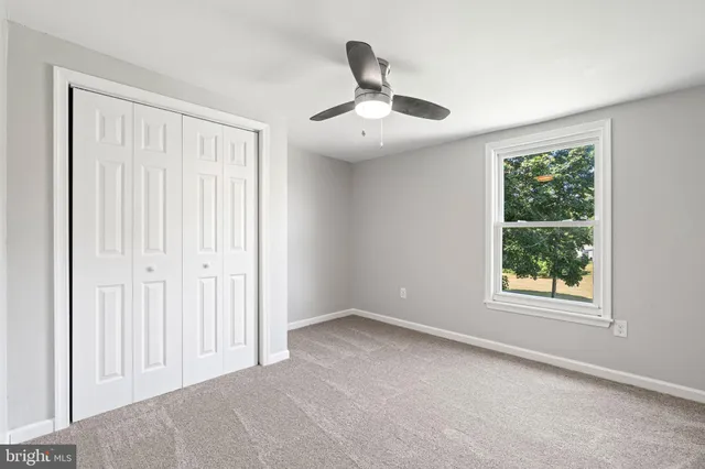 a view of backyard with a deck and wooden floor
