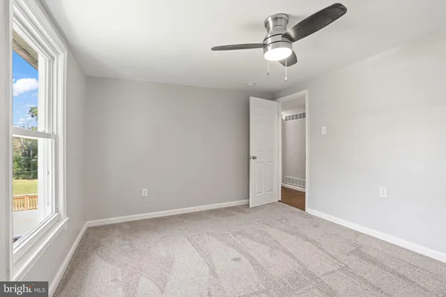 a view of balcony with wooden floor and fence