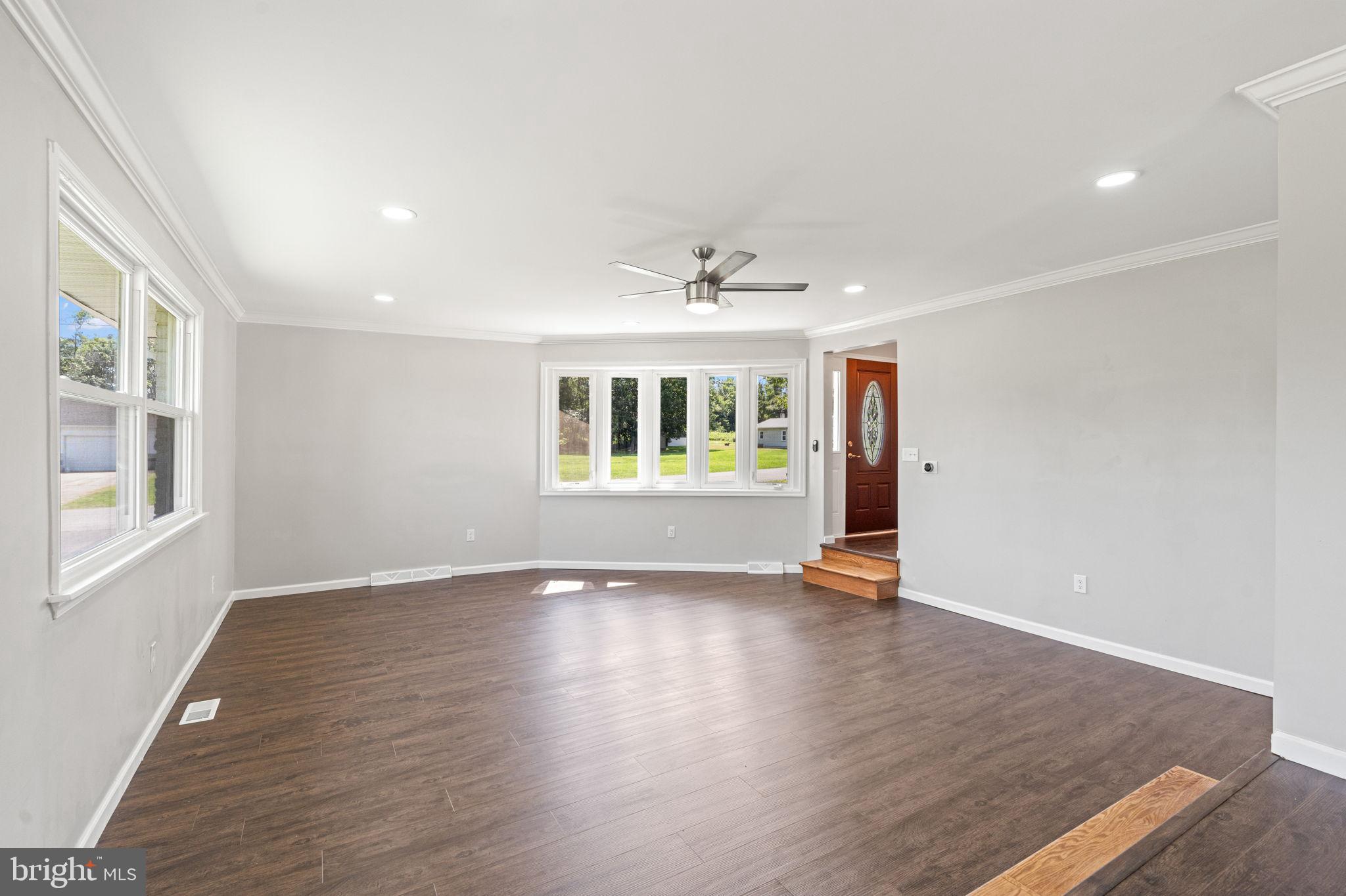 1005 2nd Avenue Manchester, PA 17345 - Photo 10 of 54 an empty room with wooden floor and windows
