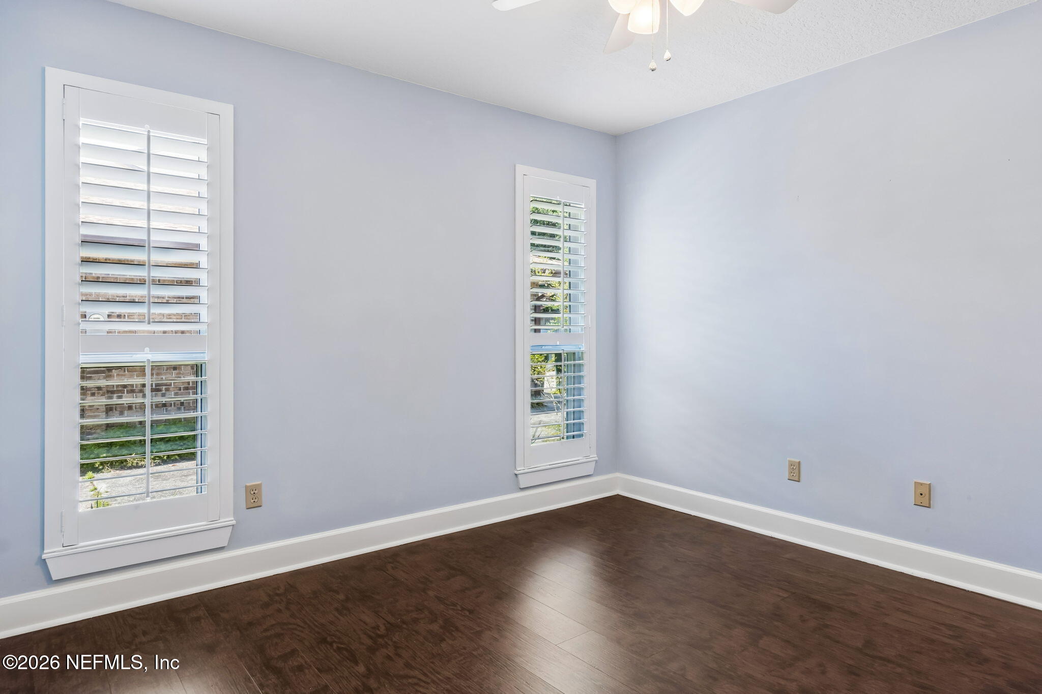 1877 Christopher Point Road South Jacksonville, FL 32217 - Photo 18 of 27 a view of an empty room with wooden floor and a window