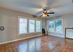 909 Duncan Lane, Unit A Austin, TX 78705 - Photo 11 of 18 a view of n empty room with window and ceiling fan