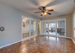 909 Duncan Lane, Unit A Austin, TX 78705 - Photo 7 of 18 a view of a livingroom with a ceiling fan and window
