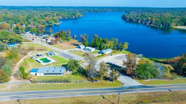 an aerial view of a house with a lake view
